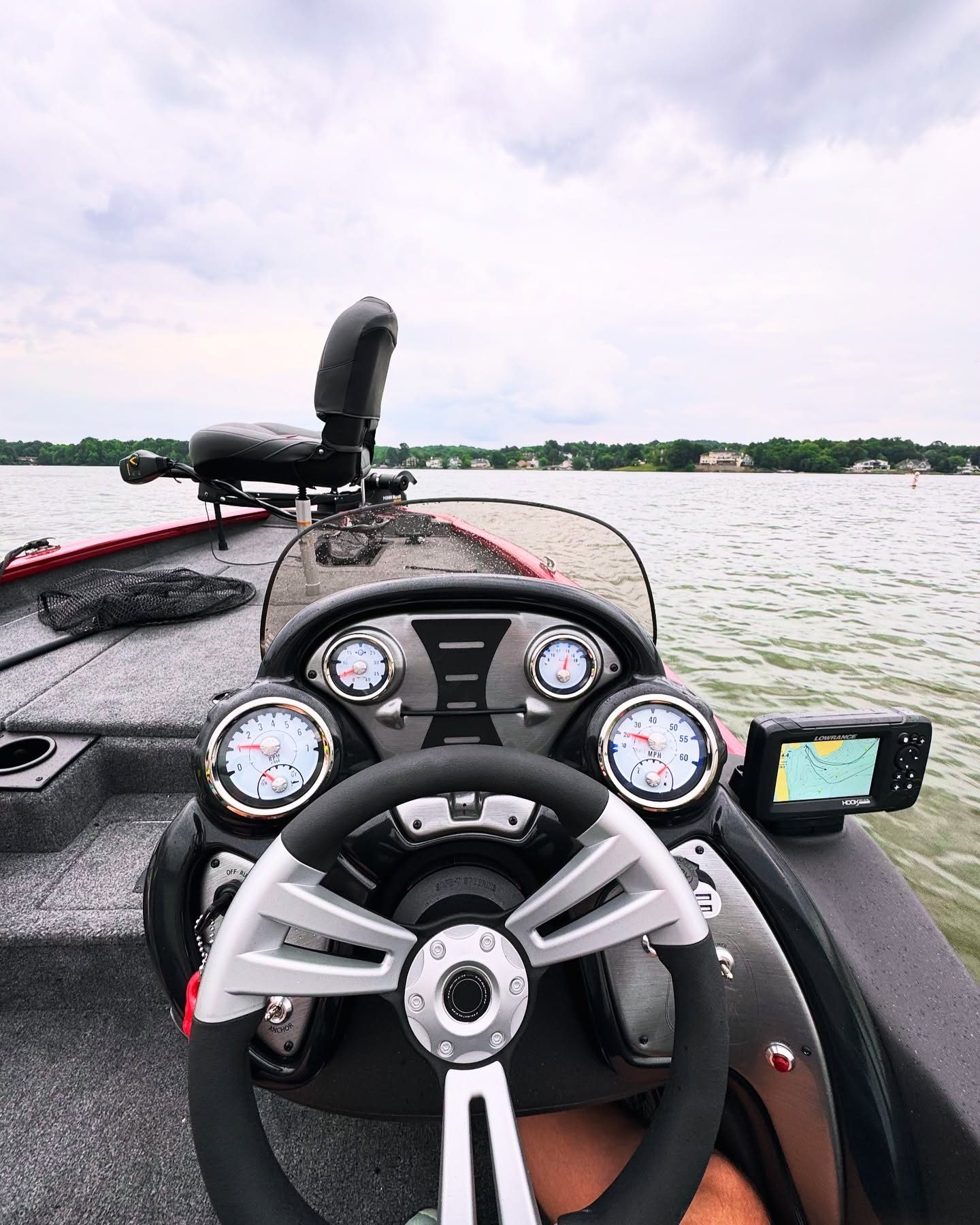 Behind the wheel of the Tracker 175 on Lake Wylie, gauges and Lowrance graph in view