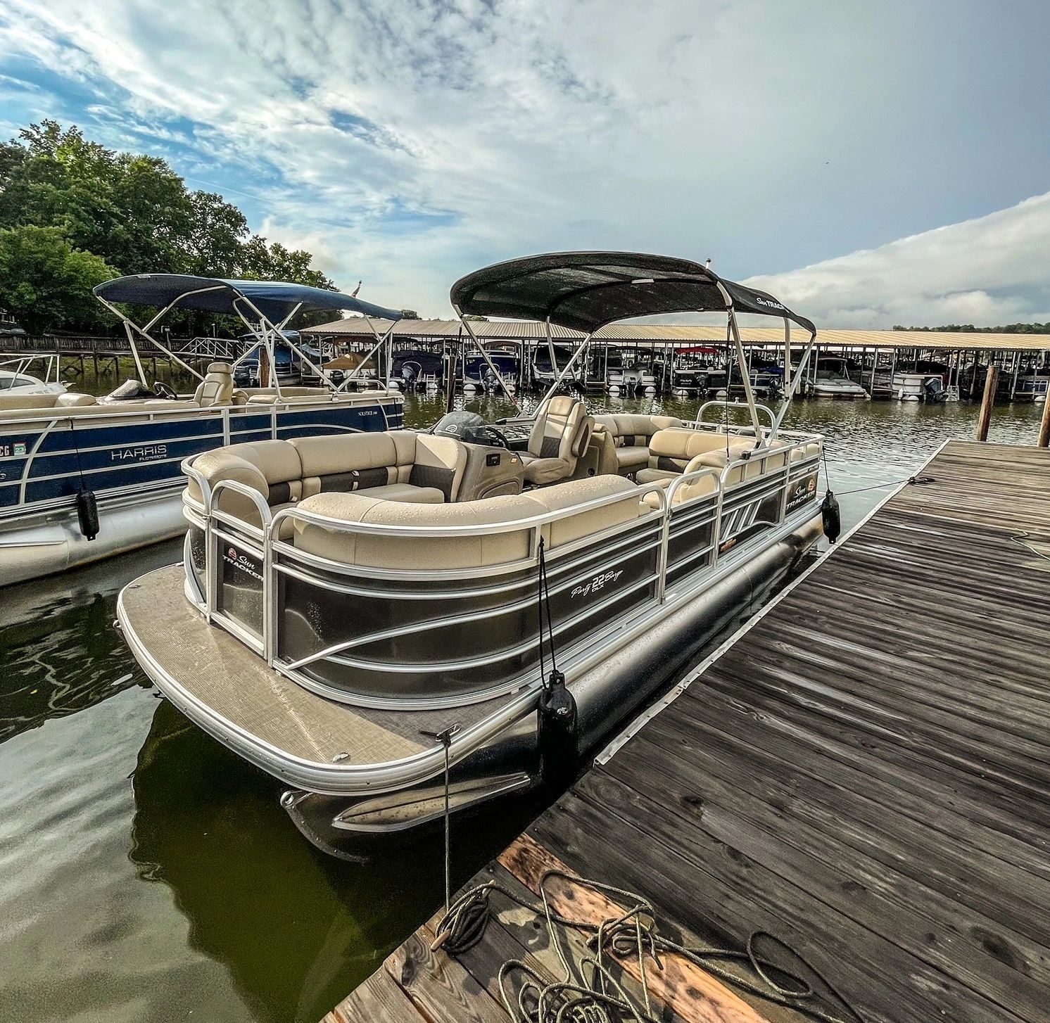 The pontoon's bow seating and rails at the dock
